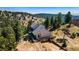 Aerial view of home with multiple decks, surrounded by natural landscape and mature trees at 251 Ridgeview Ln, Boulder, CO 80302