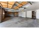 Spacious two-car garage with utility shelving, ceiling-mounted hardware, and room for storage at 251 Ridgeview Ln, Boulder, CO 80302