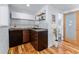 Contemporary kitchenette with sleek wood cabinets and open shelving, perfect for efficient living at 251 Ridgeview Ln, Boulder, CO 80302