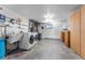 Spacious laundry room with modern washer and dryer, utility sink, and ample storage at 251 Ridgeview Ln, Boulder, CO 80302