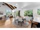 Inviting living room and dining area with a rustic ceiling and tree views at 251 Ridgeview Ln, Boulder, CO 80302