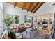 Bright living room with vaulted ceilings, wood beams, and large windows with picturesque outdoor views at 251 Ridgeview Ln, Boulder, CO 80302