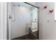 Contemporary tiled shower featuring glass enclosure, sleek fixtures, and modern design at 251 Ridgeview Ln, Boulder, CO 80302