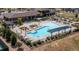 Aerial view of a community pool with sun loungers and a clubhouse at 22345 E Bailey Pl, Aurora, CO 80016