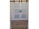 Modern barn door featuring glass paneling that provides style, and functionality at 22345 E Bailey Pl, Aurora, CO 80016