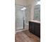 Bathroom with a sleek glass-enclosed shower with white subway tile and a built in seat at 22345 E Bailey Pl, Aurora, CO 80016