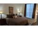 Bedroom showcasing a queen bed, nightstand, and natural light from the window at 22345 E Bailey Pl, Aurora, CO 80016