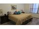 Cozy bedroom featuring a queen bed, two nightstands, and a relaxing ambiance at 22345 E Bailey Pl, Aurora, CO 80016