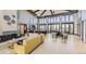A spacious clubhouse interior with ample seating, fireplace, and modern design at 22345 E Bailey Pl, Aurora, CO 80016