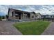 Beautiful home exterior with a covered porch, stone accents, and meticulously maintained landscaping at 22345 E Bailey Pl, Aurora, CO 80016