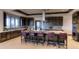 The kitchen features dark wood cabinetry and a large center island with bar stool seating at 22345 E Bailey Pl, Aurora, CO 80016