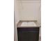 Laundry room sink with cabinet, wire shelving, and ample space at 22345 E Bailey Pl, Aurora, CO 80016