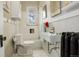 Clean bathroom with white sink, toilet, and bathtub at 1441 N Pennsylvania St # 3, Denver, CO 80203