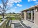 Back deck made of wood featuring built-in benches and stairs down to the yard at 12798 Tomahawk Rd, Parker, CO 80138