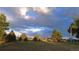 Backyard with beautiful skies and scattered trees at 12798 Tomahawk Rd, Parker, CO 80138