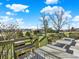 Backyard view from deck overlooking lawn, landscaping and mature trees at 12798 Tomahawk Rd, Parker, CO 80138