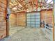 Interior of barn with metal siding and wooden walls, with partial roof and natural light at 12798 Tomahawk Rd, Parker, CO 80138