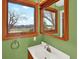 Bathroom featuring a sink with a large mirror and a bright window, providing a fresh and airy atmosphere at 12798 Tomahawk Rd, Parker, CO 80138