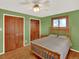 Charming bedroom with hardwood floors, natural light, and wood accents, creating a relaxing and inviting space at 12798 Tomahawk Rd, Parker, CO 80138