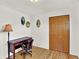 Bedroom showing a desk and chair, hardwood floors, closet, and vintage artwork at 12798 Tomahawk Rd, Parker, CO 80138