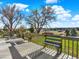 Inviting wooden deck with built-in benches offering scenic views of the surrounding landscape at 12798 Tomahawk Rd, Parker, CO 80138