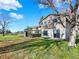 The home's rear elevation displays a blend of siding, sliding glass doors, and a spacious backyard at 12798 Tomahawk Rd, Parker, CO 80138