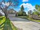 Two-story home featuring a spacious driveway, a two-car garage, and established landscaping at 12798 Tomahawk Rd, Parker, CO 80138