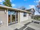 The rear exterior showcases glass doors to the deck, complemented by neutral siding and a view of the back at 12798 Tomahawk Rd, Parker, CO 80138