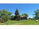 Exterior of a home showcasing the large, manicured lot and the home's design at 12798 Tomahawk Rd, Parker, CO 80138