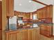 Spacious kitchen featuring wood cabinets, granite countertops, and a central island perfect for meal prep and entertaining at 12798 Tomahawk Rd, Parker, CO 80138