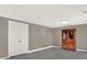 Living room featuring light gray walls, neutral carpeting, and a closet at 12798 Tomahawk Rd, Parker, CO 80138