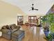 Open living area with hardwood floors, a dining table, and a view to the outside at 12798 Tomahawk Rd, Parker, CO 80138