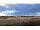 Distant view of houses and property against cloudy blue skies at 12798 Tomahawk Rd, Parker, CO 80138