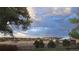 Scenic view of trees and sky with a building in the background at 12798 Tomahawk Rd, Parker, CO 80138