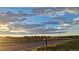 Street view of open field with blue sky and cloudy horizon at 12798 Tomahawk Rd, Parker, CO 80138