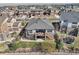 Aerial view of the home showcasing the backyard, patio, upper deck, and surrounding neighborhood at 27423 E Euclid Dr, Aurora, CO 80016