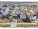 Aerial view of the home featuring a well-maintained front yard, driveway, and two-car garage at 27423 E Euclid Dr, Aurora, CO 80016