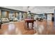 Finished basement with pool table, fireplace, and ample seating areas at 27423 E Euclid Dr, Aurora, CO 80016