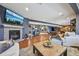 Spacious finished basement with fireplace, wood floors, and comfortable seating at 27423 E Euclid Dr, Aurora, CO 80016