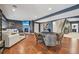Finished basement with fireplace, tv, game table, seating and staircase at 27423 E Euclid Dr, Aurora, CO 80016