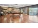 Basement game room featuring a pool table and rustic wood wall accent at 27423 E Euclid Dr, Aurora, CO 80016
