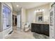 Bathroom featuring walk-in shower, closet, toilet, and vanity with mirror and sink at 27423 E Euclid Dr, Aurora, CO 80016