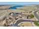 Aerial view showcasing the community clubhouse, pool, and scenic lake offering a luxurious and recreational experience at 27423 E Euclid Dr, Aurora, CO 80016