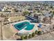 Aerial view of the clubhouse and pool area, an appealing spot for relaxation and recreation within the community at 27423 E Euclid Dr, Aurora, CO 80016