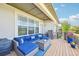Comfortable upper deck with a modular couch, grill, and flowers with views at 27423 E Euclid Dr, Aurora, CO 80016