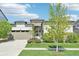 Charming single-story home with a well-manicured lawn and attached two-car garage at 27423 E Euclid Dr, Aurora, CO 80016