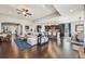 Expansive living space with a kitchen island, dining area, and comfortable seating, perfect for entertaining at 27423 E Euclid Dr, Aurora, CO 80016