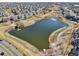 The pond features a charming structure and tranquil water, creating a peaceful and picturesque community setting at 27423 E Euclid Dr, Aurora, CO 80016