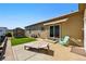 Exterior backyard showcasing a patio with furniture, storage shed and lawn at 6231 Indian Paintbrush St # 214, Frederick, CO 80530