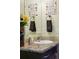 Close-up view of a granite countertop with sunflower decorations in a serene bathroom setting at 6231 Indian Paintbrush St # 214, Frederick, CO 80530